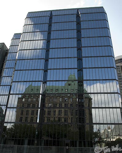 ArcticQ_20080825_101226_484_20.jpg - Part of Canada's Parliament complex reflects in the shiny windows of an office building nearby.  Ottawa, Canada.