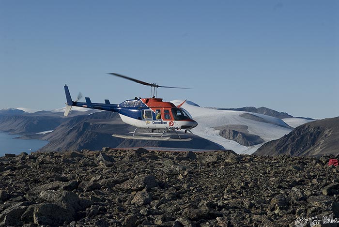 ArcticQ_20080829_144832_829_20.jpg - Our helicopter lands atop the mountan where Peary's monument is located.  Cape York, Nunavut, Canada.