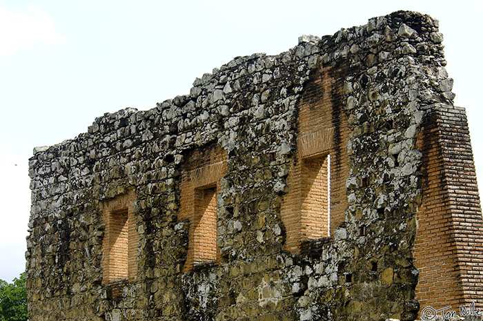 CostaRica_20100316_111130_216_2X.jpg - A low sun streams through windows on a darkening wall of a ruin from the old city of Panama.  Panama City, Panama.