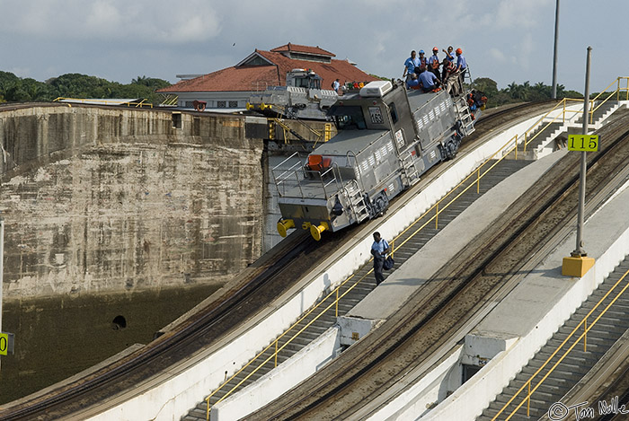 CostaRica_20100318_164106_770_20.jpg - One of the canal's engines rides its cog rail up the slope to the higher level of the lock, offering a free ride to some workers.  Panama Canal.