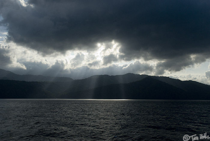 CostaRica_20100319_085358_861_20.jpg - The rain forest of Panama is lit by stray sunbeams passing through ominous clouds.  Panama Coast east of Panama City.