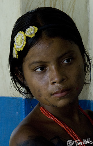 CostaRica_20100319_125354_127_2X.jpg - A young Embra girl who seems more pensive than other children.  We saw this several times; some children appeared happy and comfortable with us and others were more withdrawn.  Playa de Muerto, Darien, Panama.