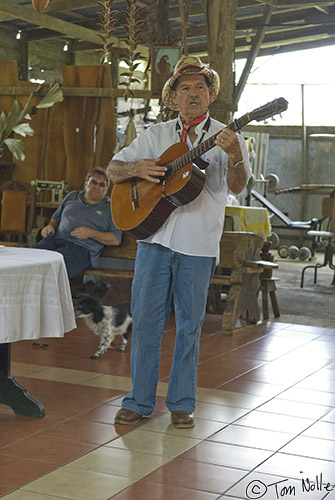 CostaRica_20100328_142956_180_20.jpg - The owner of a small plantation sings for us.  Arenal Costa Rica.