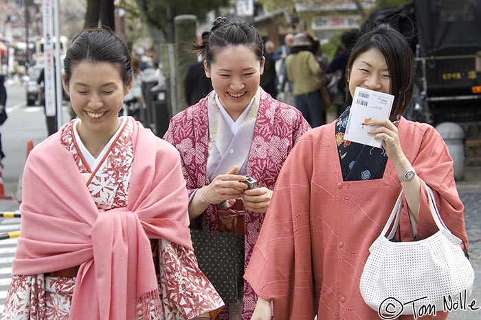 Japan_20080411_020910_420_2X.jpg - Three young women dress in traditional style but without the formal makeup and highly structured garment layers of a true Geisha.  Kyoto Japan.