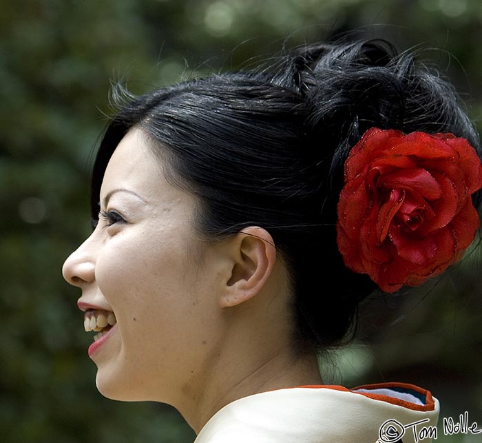 Japan_20080411_224510_642_2X.jpg - A young Japanese woman enjoys the gardens in Heian Jingu Shrine Kyoto Japan.