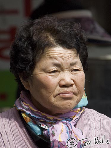 Japan_20080420_011916_631_2X.jpg - This lady is apparently a bit pensive.  Traditional market, Kyongju South Korea