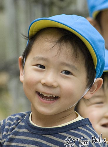 Japan_20080422_221614_211_2X.jpg - A boy is happy to see some interesting tourists at Shikoku-Mura, Takamatsu, Japan.