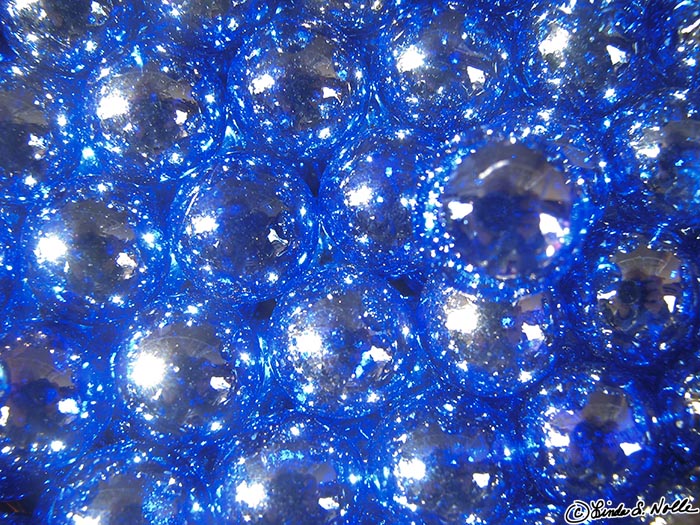 Japan_20080411_015208_298_S.jpg - Blue glass beads form an abstract pattern in the sun at a roadside market near Tenryu-Ji, Kyoto Japan.