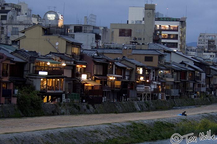 Japan_20080411_053312_500_2X.jpg - Lights from homes and shops illuminate the path along the Kamo river bank, Kyoto Japan.