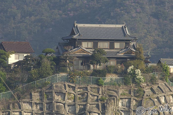 Japan_20080414_181306_791_2X.jpg - A Japanese-style home on a ridge overlooking Okayama Japan is our first sight of a small-town structure.