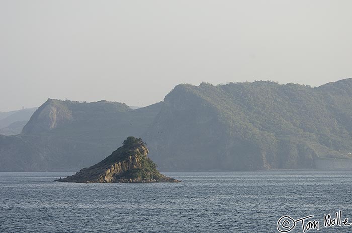 Japan_20080418_175536_269_2X.jpg - A small rocky island is clear of mist on a morning cruise into the bay at Nagasaki Japan.