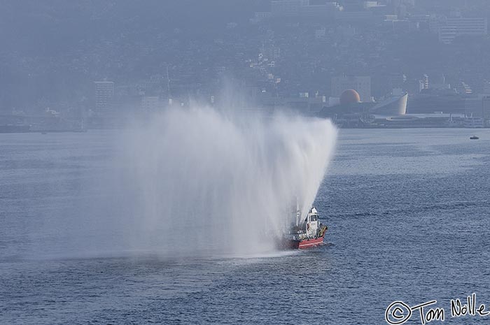 Japan_20080418_181216_309_2X.jpg - A fireboat in the harbor welcomes the Spirit of Oceanus with its typical and distinctive salute.  Nagasaki Japan.