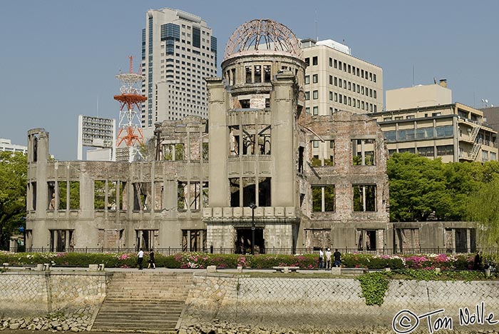 Japan_20080422_014548_694_20.jpg - The remains of an pre-bombing trade building is now known as the A-Bomb Dome, small against the modern monuments to commerce in Hiroshima, Japan.