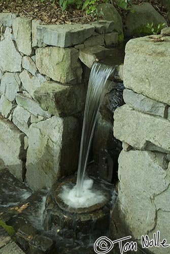 Japan_20080422_223444_918_20.jpg - A fountain pours into a stone pot in Shikoku-Mura, Takamatsu, Japan.