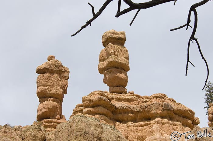 Canyonlands_20080526_143218_688_2X.jpg - Two hoodoos sit atop a rocky ridge in Red Canyon Utah.