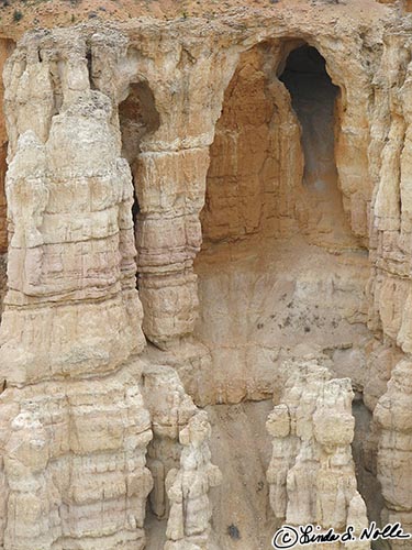 Canyonlands_20080526_173928_422_S.jpg - A deep cave carved in soft bright stone is a sharp contrast to the usual red rock of Bryce Canyon Utah.