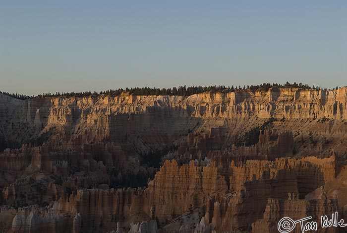 Canyonlands_20080527_082216_743_20.jpg - As the sun comes up, light over the eastern rock formations spills to reveal the texture of the rim area.  Bryce Canyon Utah.