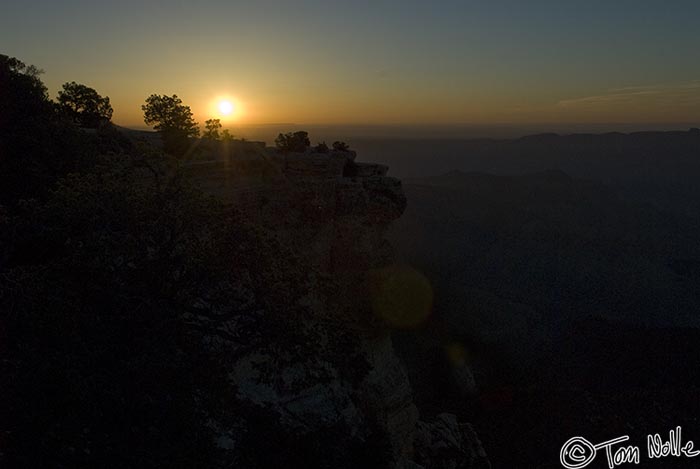 Canyonlands_20080531_082036_377_20.jpg - The sun pokes above a rocky outcrop on Grand Canyon North Rim, Arizona.