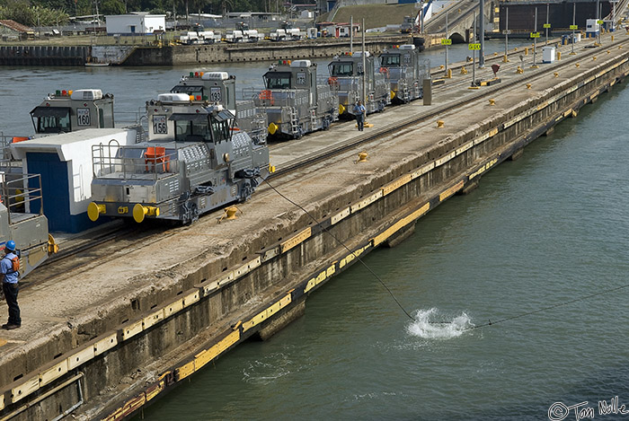 CostaRica_20100318_161816_759_20.jpg - A small line is used to pull over the heavy metal cable that will link us to this particular engine.  Four engines are used per ship for the transit.  Panama Canal, Panama.